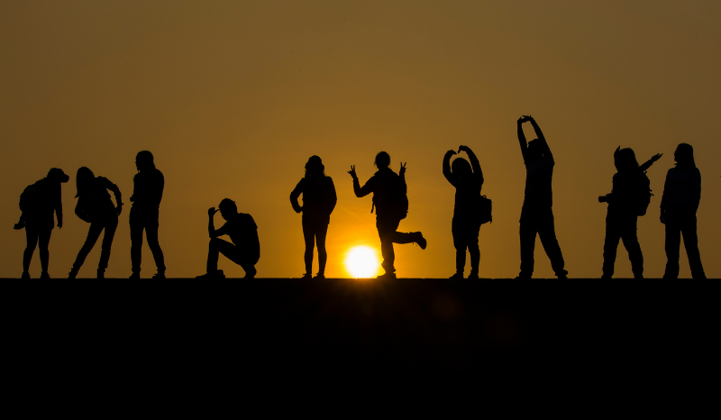 Photo of people together at a sunset
