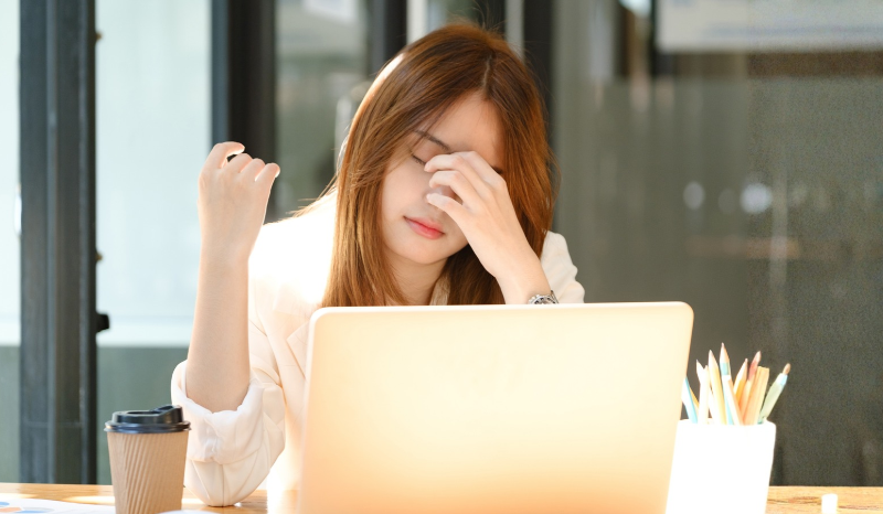 Image of a frustrated person reviewing documents