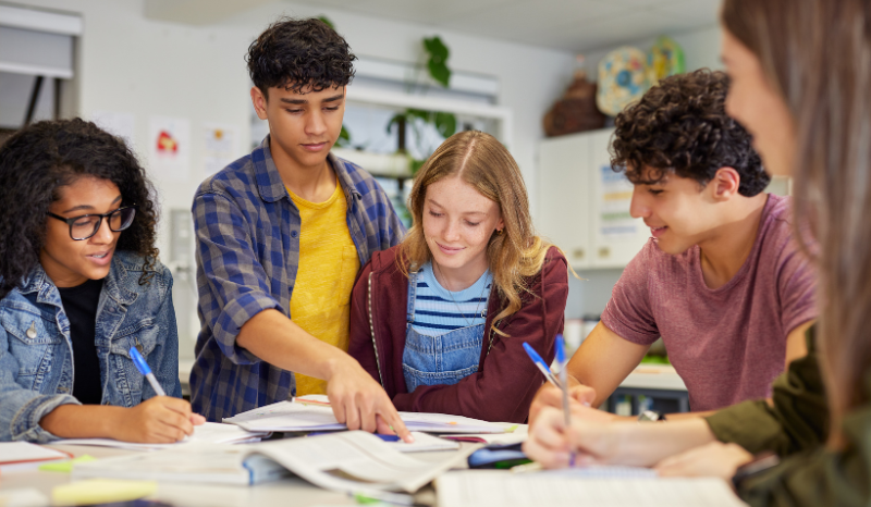 A group of students reviewing materials together